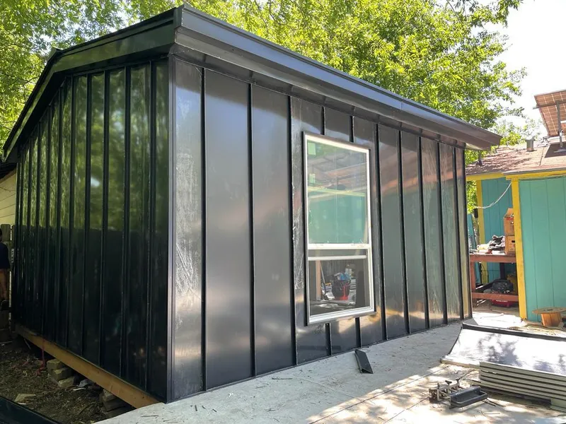 Black standing seam metal wall panels for Roof Inspection in Laketown